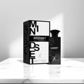 Maison Alhambra Mindset Eau de Parfum — A black perfume bottle and its white and black patterned box are displayed against a white background. The box features bold black lettering for 'MINDSET' and a deer logo. | Maison Alhambra Mindset Eau de Parfum — Botol minyak wangi hitam dan kotaknya yang bercorak hitam putih
