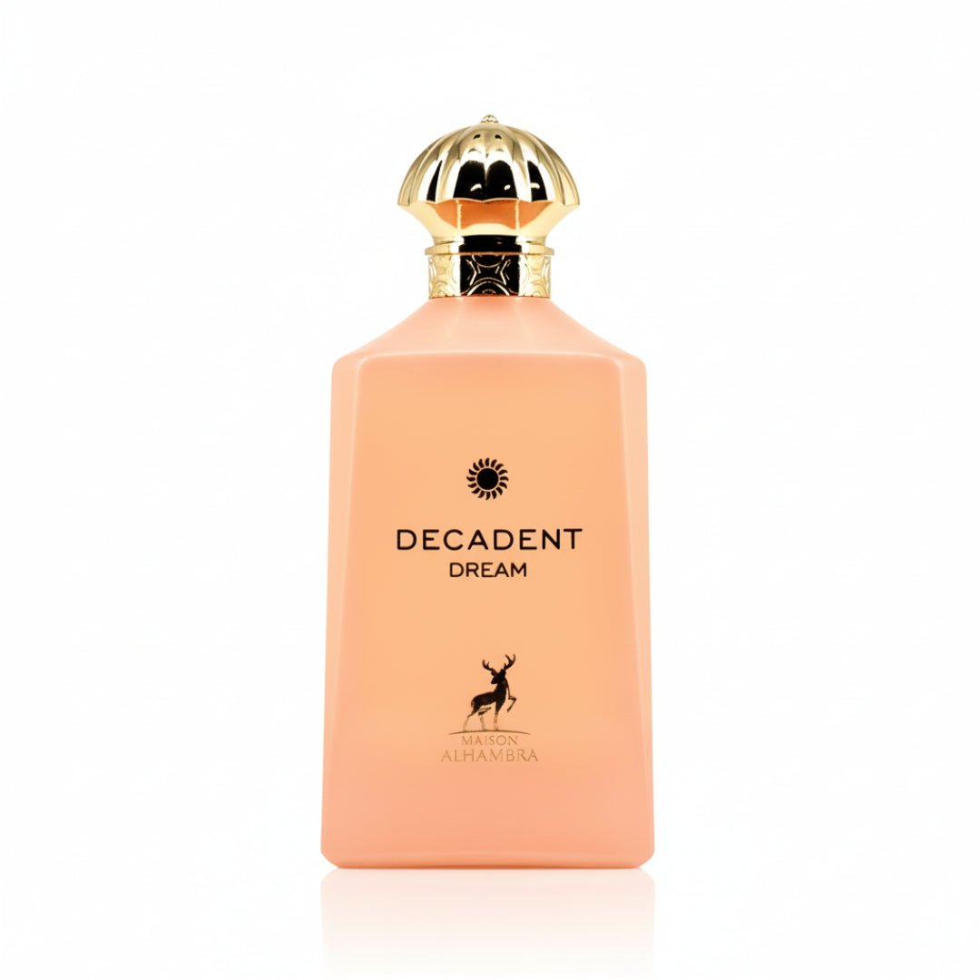 Maison Alhambra Decadent Dream — A peach-colored rectangular perfume bottle with a gold fluted cap, featuring black text 'DECADENT DREAM' and a deer silhouette logo above 'MAISON ALHAMBRA'. | Maison Alhambra Decadent Dream — Botol minyak wangi berbentuk segi empat berwarna pic dengan penutup berlubang emas