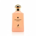 Maison Alhambra Decadent Dream — A peach-colored rectangular perfume bottle with a gold fluted cap, featuring black text 'DECADENT DREAM' and a deer silhouette logo above 'MAISON ALHAMBRA'. | Maison Alhambra Decadent Dream — Botol minyak wangi berbentuk segi empat berwarna pic dengan penutup berlubang emas