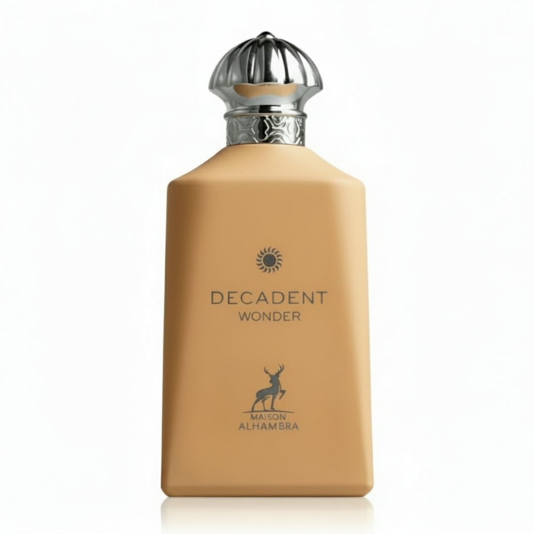 Maison Alhambra Decadent Wonder Her EDP 100 ml Alhambra — A tan-colored perfume bottle with a silver ornate cap and a silver deer logo on a white background. | Maison Alhambra Decadent Wonder Her EDP 100 ml Alhambra — Botol minyak wangi berwarna tan dengan penutup perak berhias dan logo rusa perak pada latar belakang