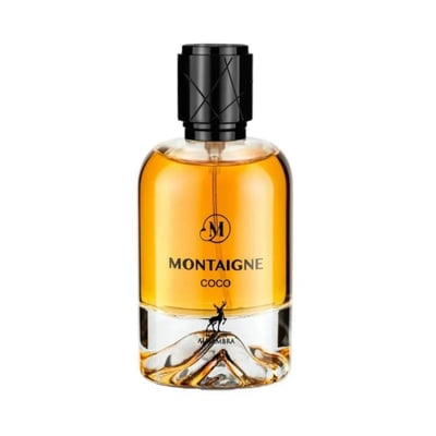 Maison Alhambra Montaigne Coco EDP — A clear glass perfume bottle with amber liquid and a black textured cap, featuring a deer silhouette and mountain-like base design. | Botol minyak wangi kaca jernih dengan cecair berwarna ambar dan penutup bertekstur hitam, menampilkan siluet rusa dan reka bentuk tapak seperti