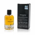 Maison Alhambra Montaigne Coco — Glass perfume bottle with yellow liquid and a black cap, next to its black packaging box with text and a holographic sticker. | Maison Alhambra Montaigne Coco — Botol minyak wangi kaca dengan cecair kuning dan penutup hitam, bersebelahan kotak pembungkus hitamnya dengan teks dan
