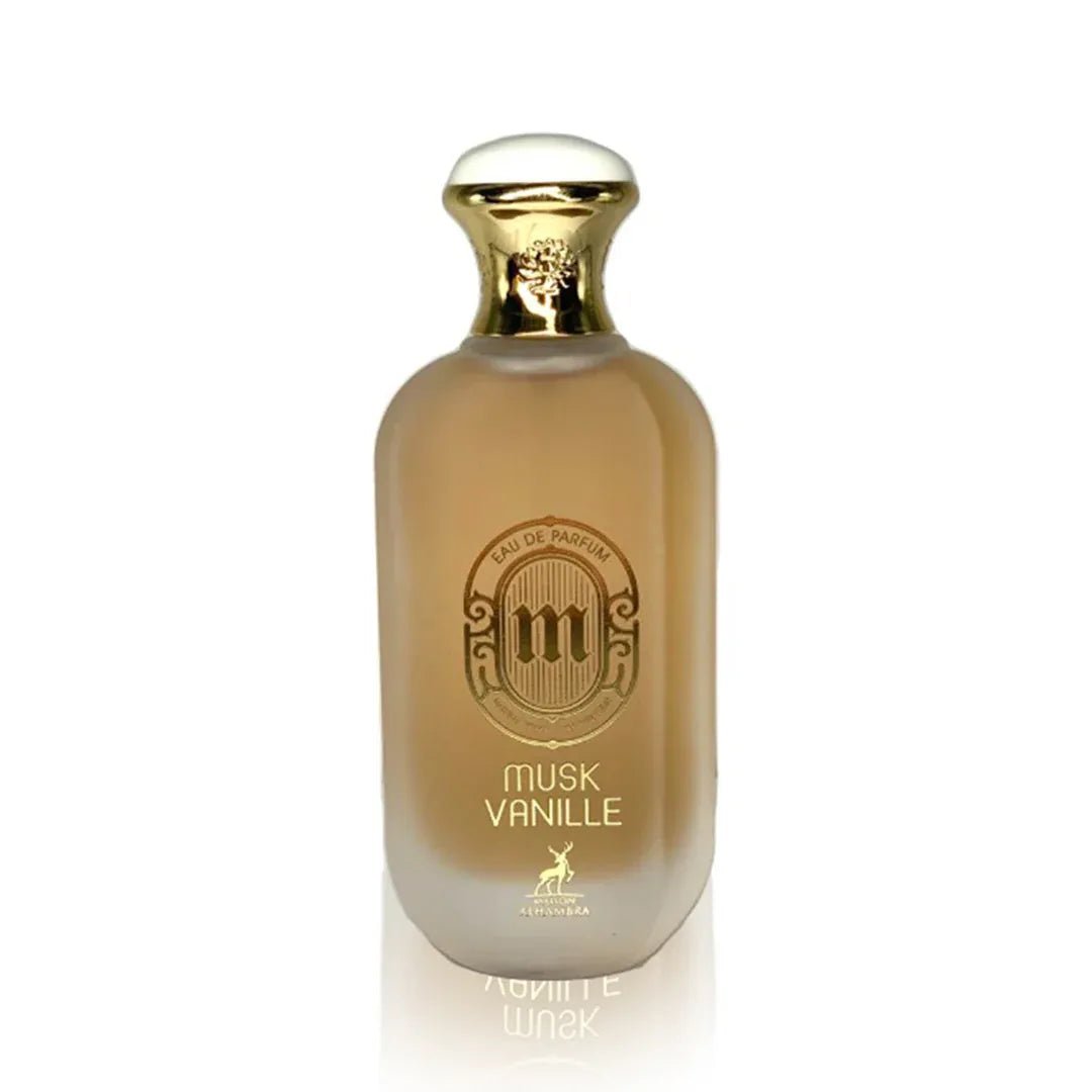 Maison Alhambra Musk Vanille by Maison Alhambra 100ml EDP — A frosted glass perfume bottle with a gold cap and a circular label featuring the letter 'm' and text 'EAU DE PARFUM', 'MUSK VANILLE', and a deer illustration. | Maison Alhambra Musk Vanille by Maison Alhambra 100ml EDP — Botol kaca beku dengan penutup emas