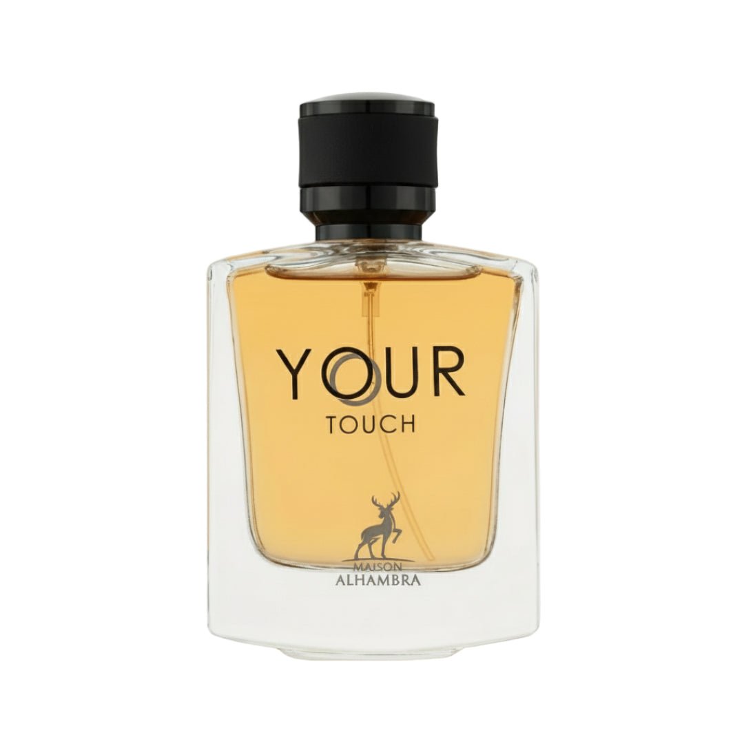 Maison Alhambra Your Touch Man by Maison Alhambra – 100 ml — A clear glass perfume bottle with amber liquid and a black cap, featuring the text "YOUR TOUCH" and a deer silhouette logo. | Maison Alhambra Your Touch Man by Maison Alhambra – 100 ml — Botol minyak wangi kaca jernih dengan cecair berwarna ambar dan penutup