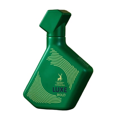 Maison Alhambra Luxe Bold — Green perfume bottle with gold accents and a deer logo, angled view against a white background. | Botol minyak wangi hijau Maison Alhambra Luxe Bold dengan aksen emas dan logo rusa, pandangan bersudut berlatarkan putih.