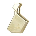 Maison Alhambra Luxe Gold by Maison Alhambra – 100 ml Unisex — A gold-colored perfume bottle with a geometric cap and a patterned design on the body, featuring a deer logo and text. | Maison Alhambra Luxe Gold by Maison Alhambra – 100 ml Unisex — Botol minyak wangi berwarna emas dengan penutup geometri dan reka bentuk