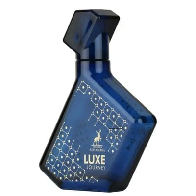 Maison Alhambra Luxe Journey — Blue glass perfume bottle with a geometric white pattern and a deer silhouette | Maison Alhambra Luxe Journey — Botol kaca biru dengan corak putih geometrik dan siluet rusa