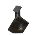 Maison Alhambra Luxe Street — A dark, angular perfume bottle with a geometric pattern on the side and a deer logo | Maison Alhambra Luxe Street — Botol minyak wangi gelap bersudut dengan corak geometri di sisi dan logo rusa