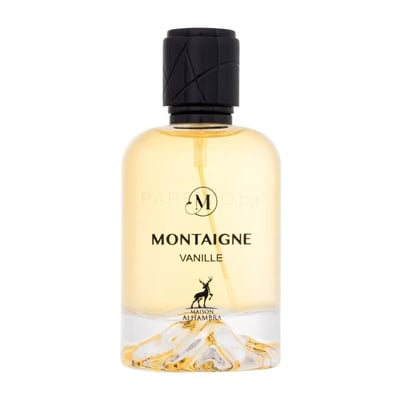 Maison Alhambra Montaigne Vanille — A clear glass perfume bottle with a black textured cap, golden liquid, and a decorative mountain landscape at the base, featuring a deer silhouette logo. | Maison Alhambra Montaigne Vanille — Botol minyak wangi kaca jernih dengan penutup bertekstur hitam, cecair keemasan, dan