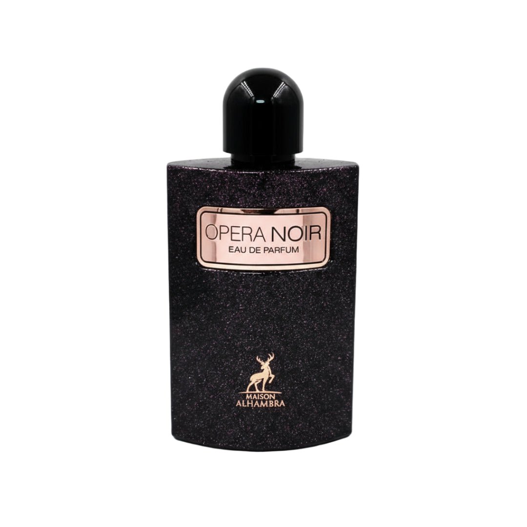 Maison Alhambra Opera Noir — Black glittery perfume bottle with a gold label that says "OPERA NOIR EAU DE PARFUM" and a gold deer logo below. | Botol pewangi hitam berkilauan dengan label emas bertuliskan "OPERA NOIR EAU DE PARFUM" dan logo rusa emas di bawah.