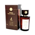 Maison Alhambra Smoked Oud & Vanilla — A brown perfume box stands next to a matching brown glass perfume bottle with a dark wooden cap and gold emblem. The box has text and a deer logo. | Maison Alhambra Smoked Oud & Vanilla — Kotak minyak wangi berwarna coklat berdiri di sebelah botol minyak wangi kaca coklat yang