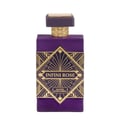 Maison Alhambra Infini Rose — A purple perfume bottle with a gold geometric art deco design on the front and a gold ridged collar below a dark purple cap. | Maison Alhambra Infini Rose — Botol minyak wangi ungu dengan reka bentuk art deco geometri emas di hadapan dan kolar berjalur emas di bawah penutup ungu gelap.