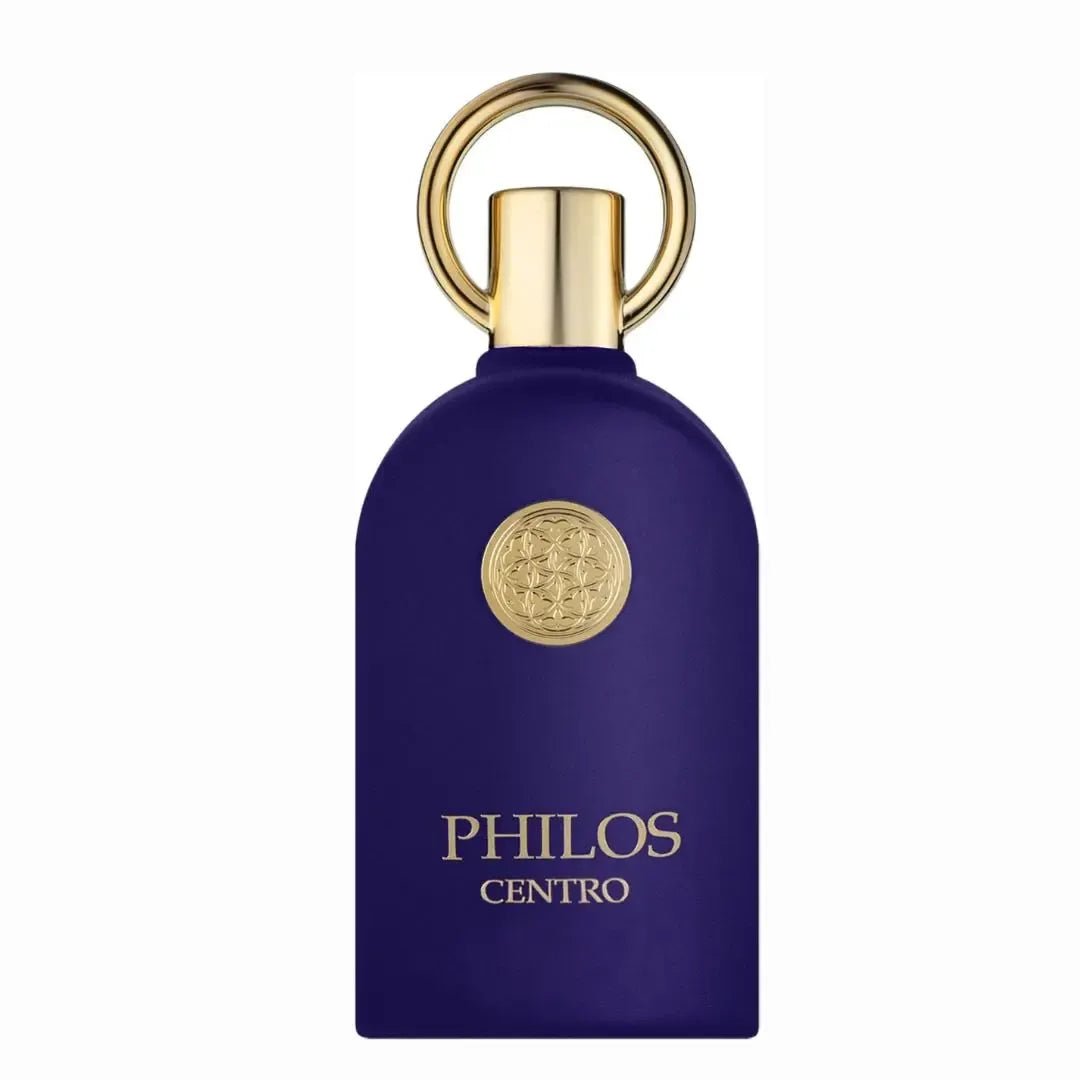 Maison Alhambra Philos Centro Maison Alhambra 100ml EDP — A dark blue perfume bottle with a gold circular emblem and a gold ring on top, set against a white background. | Maison Alhambra Philos Centro Maison Alhambra 100ml EDP — Botol minyak wangi biru gelap dengan lambang bulat emas dan cincin emas di atasnya