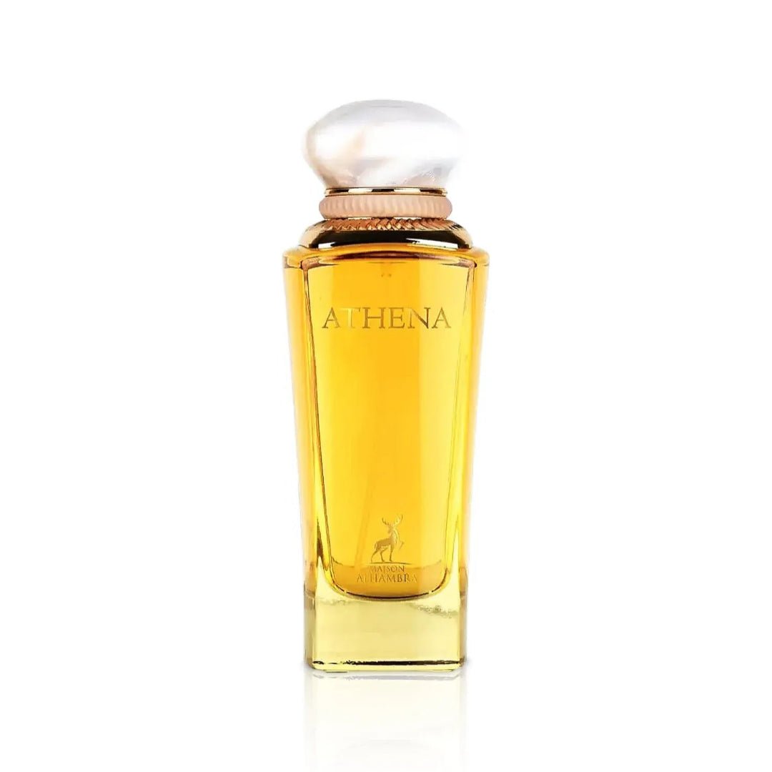 Maison Alhambra Athena Eau de Parfum 100 ml Ville Femme — A tall, clear glass perfume bottle with golden liquid and a white, pearl-like cap, featuring the brand name 'ATHENA' and a deer logo on the front. | Maison Alhambra Athena Eau de Parfum 100 ml Ville Femme — Botol kaca jernih tinggi dengan cecair keemasan dan