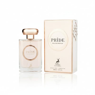 Maison Alhambra Pride by Maison Alhambra 100ml EDP Women — A clear glass perfume bottle with a rose gold cap and a circular label featuring the word PRIDE in rose gold, placed next to its matching rose gold and white box. | Maison Alhambra Pride by Maison Alhambra 100ml EDP Women — Botol minyak wangi kaca jernih