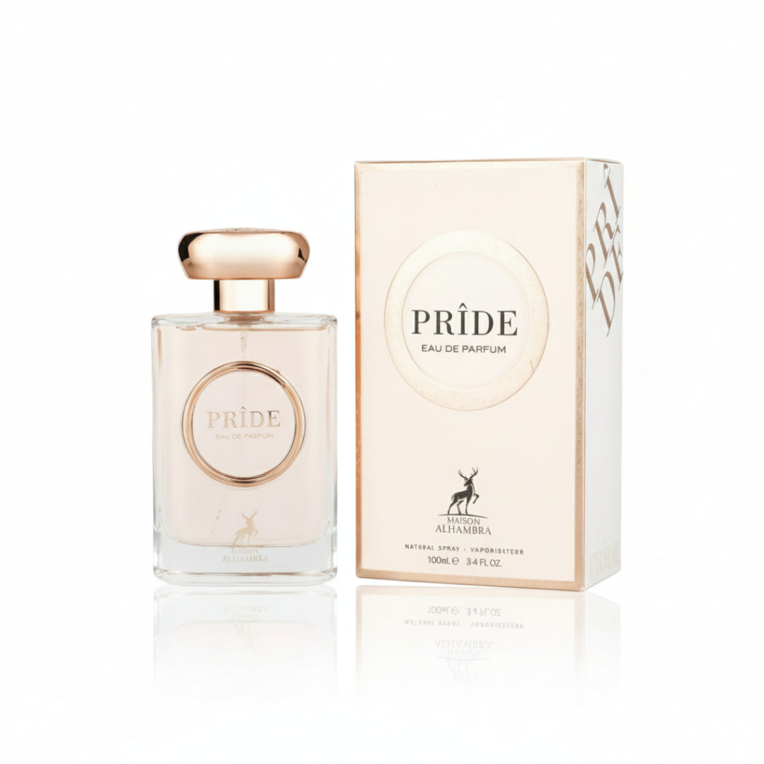 Maison Alhambra Pride by Maison Alhambra 100ml EDP Women — A clear glass perfume bottle with a rose gold cap and a circular label featuring the word PRIDE in rose gold, placed next to its matching rose gold and white box. | Maison Alhambra Pride by Maison Alhambra 100ml EDP Women — Botol minyak wangi kaca jernih