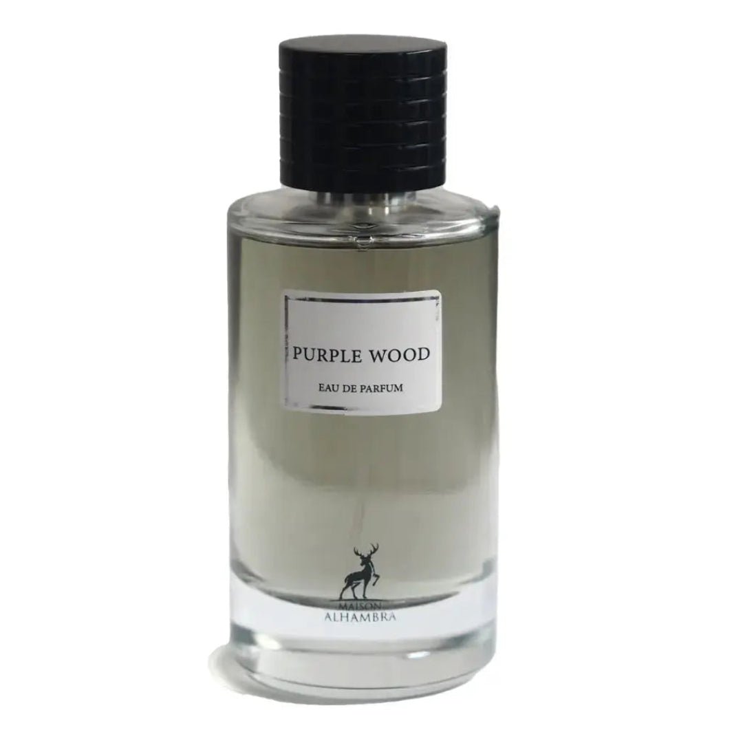 Maison Alhambra Purple Wood – Clear glass perfume bottle with a black ribbed cap, a white label reading "PURPLE WOOD EAU DE PARFUM", and a deer silhouette logo with "MAISON ALHAMBRA" text at the base. | Maison Alhambra Purple Wood – Botol minyak wangi kaca jernih dengan penutup berjalur hitam, label putih bertuliskan