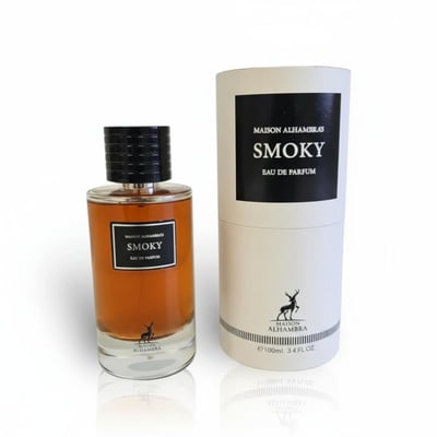 Maison Alhambra Smoky by Maison Alhambra 100ml EDP Unisex — A glass perfume bottle with amber liquid and a black cap sits next to its cylindrical packaging, both featuring the brand logo and product name. | Maison Alhambra Smoky by Maison Alhambra 100ml EDP Unisex — Botol minyak wangi kaca dengan cecair ambar dan