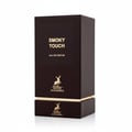 Maison Alhambra Smoky Touch by Maison Alhambra 80ml EDP — A dark brown perfume box with gold accents, featuring the text "SMOKY TOUCH EAU DE PARFUM" and a gold deer logo. | Maison Alhambra Smoky Touch by Maison Alhambra 80ml EDP — Kotak minyak wangi berwarna coklat gelap dengan aksen emas, menampilkan teks "SMOKY
