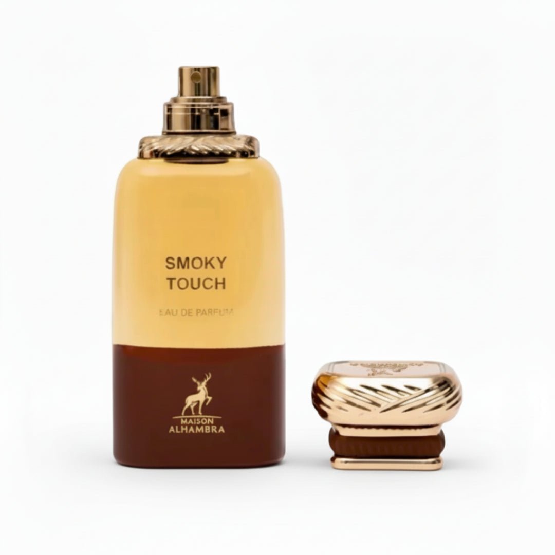 Maison Alhambra Smoky Touch by Maison Alhambra 80ml EDP — A brown and gold perfume bottle with a gold cap placed next to it on a white background. | Maison Alhambra Smoky Touch by Maison Alhambra 80ml EDP — Botol minyak wangi coklat dan emas dengan penutup emas diletakkan di sebelahnya di atas latar belakang putih.