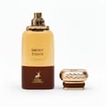Maison Alhambra Smoky Touch by Maison Alhambra 80ml EDP — A brown and gold perfume bottle with a gold cap placed next to it on a white background. | Maison Alhambra Smoky Touch by Maison Alhambra 80ml EDP — Botol minyak wangi coklat dan emas dengan penutup emas diletakkan di sebelahnya di atas latar belakang putih.