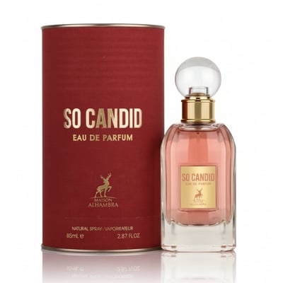 Maison Alhambra So Candid by Maison Alhambra 100 ml EDP — A red cylindrical box with gold text and a deer logo stands next to a clear glass perfume bottle filled with pink liquid, featuring a gold collar and a clear spherical cap. | Maison Alhambra So Candid by Maison Alhambra 100 ml EDP — Kotak silinder merah dengan