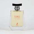 Maison Alhambra Toro Pour Homme Glace — A clear glass perfume bottle with a light yellow liquid, a black and silver cap, and orange text and a deer logo on the front. | Maison Alhambra Toro Pour Homme Glace — Botol kaca jernih berisi cecair kuning muda, penutup hitam dan perak, serta teks oren dan logo rusa di hadapan.