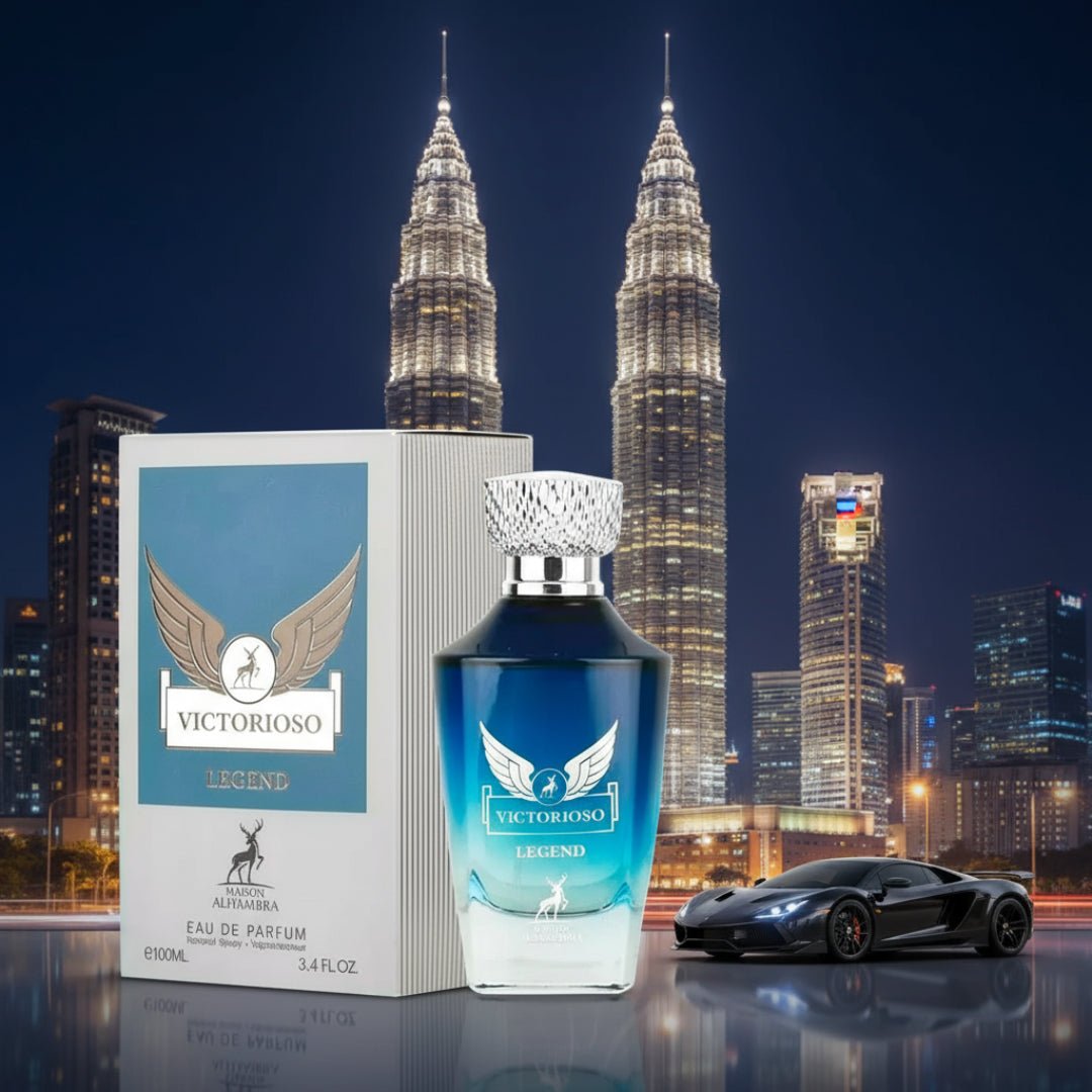 Maison Alhambra Victorioso Legend by Maison Alhambra 100 ml for Men — A perfume bottle and its box are displayed in front of the Petronas Twin Towers at night, with a black sports car on the right. | Maison Alhambra Victorioso Legend by Maison Alhambra 100 ml for Men — Botol minyak wangi dan kotaknya dipamerkan di
