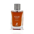 Maison Alhambra Your Touch Intense — A clear glass perfume bottle with amber liquid and a silver ribbed cap, featuring white text 'YOUR TOUCH INTENSE' and a deer logo | Maison Alhambra Your Touch Intense — Botol kaca jernih dengan cecair ambar dan penutup berjalur perak, menampilkan teks putih 'YOUR TOUCH INTENSE' dan