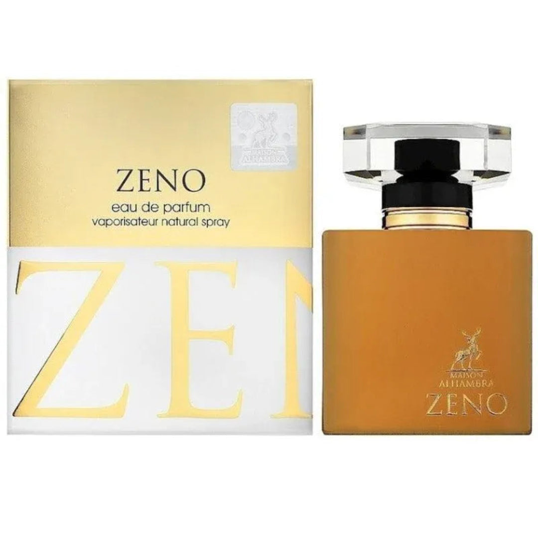 Maison Alhambra Zeno – A gold and white box with the text "ZENO eau de parfum vaporisateur natural spray" and large gold letters "ZE" is shown next to a square amber glass perfume bottle with a clear faceted cap and gold accents. | Maison Alhambra Zeno – Kotak emas dan putih dengan teks "ZENO eau de parfum